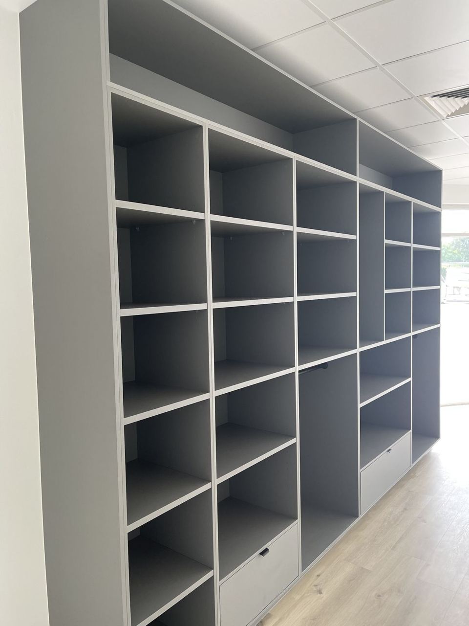 Full-height retail shelving wall